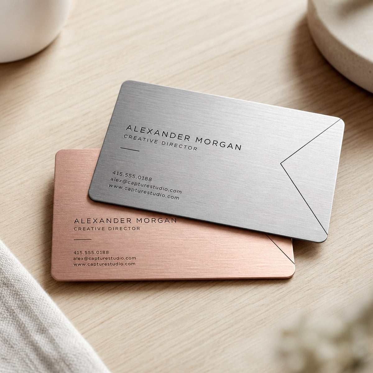 Metal Business Cards on brushed silver and rose gold aluminum